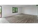 Bright, open living area with elegant hardwood floors and a large window offering ample natural light at 1408 Snead Cir, Avon, IN 46123