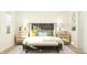 Cozy bedroom featuring a stylish bed with decorative pillows, bedside tables, and modern art for a relaxing retreat at 15363 Alperton Rd, Fishers, IN 46037