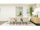 Contemporary dining room featuring a modern table, chairs, and a view to the outside at 15363 Alperton Rd, Fishers, IN 46037