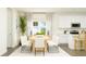Bright dining area with modern table, chairs, and lots of natural light at 15363 Alperton Rd, Fishers, IN 46037