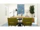 Bright office space featuring a wood desk, olive green chairs, and modern decor for a productive work environment at 15363 Alperton Rd, Fishers, IN 46037