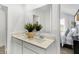 Contemporary bathroom with double vanity, a large mirror, and stylish fixtures with natural light at 15387 Alperton Rd, Fishers, IN 46037