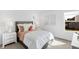 Charming bedroom features shiplap walls, plush bedding, and bright natural light from windows at 15387 Alperton Rd, Fishers, IN 46037