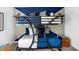 Stylish ' bedroom featuring bunk beds, decorative pillows, and a unique accent wall at 15387 Alperton Rd, Fishers, IN 46037