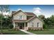 Charming two-story home with a brick foundation, covered porch, manicured lawn, and neutral color palette at 15387 Alperton Rd, Fishers, IN 46037
