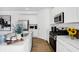 Bright kitchen featuring stainless steel appliances, quartz counters, white cabinets, and a decorative backsplash at 15387 Alperton Rd, Fishers, IN 46037