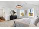 Bright main bedroom features a vaulted ceiling, dual windows, and an open entry to the en suite at 15387 Alperton Rd, Fishers, IN 46037
