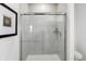 Contemporary bathroom featuring a sleek glass-enclosed shower and modern fixtures at 15387 Alperton Rd, Fishers, IN 46037