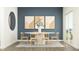 Modern dining room with oval table, chairs, light wood floors and blue accent wall at 15395 Alperton Rd, Fishers, IN 46037