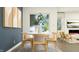 Stylish dining area with round table, modern chairs, and a view to the outdoors at 15395 Alperton Rd, Fishers, IN 46037