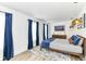 Bright bedroom with stylish bedding, modern lighting fixtures, and ample natural light at 1620 W New York St, Indianapolis, IN 46222