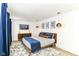 Bedroom featuring stylish decor, a comfortable bed, and elegant lighting, perfect for relaxation at 1620 W New York St, Indianapolis, IN 46222
