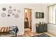 Bright bedroom with eclectic decor, light hardwood floors and a view to the attached bathroom at 1620 W New York St, Indianapolis, IN 46222