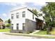 Contemporary two-story home showcases a well-manicured lawn and a modern, two-tone facade at 1620 W New York St, Indianapolis, IN 46222