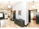 Well-lit foyer showcasing hardwood floors, modern lighting, and tastefully decorated walls at 1620 W New York St, Indianapolis, IN 46222