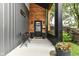 Inviting front porch with sleek furniture and stylish decor, enhancing curb appeal at 1620 W New York St, Indianapolis, IN 46222