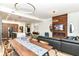 Open-concept living space with modern kitchen, dining area, and hardwood floors at 1620 W New York St, Indianapolis, IN 46222