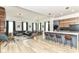 Open-concept living space with modern kitchen island, hardwood floors, and stylish decor at 1620 W New York St, Indianapolis, IN 46222