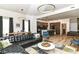 Spacious living room featuring an open floor plan, modern lighting and a stylish leather sectional at 1620 W New York St, Indianapolis, IN 46222