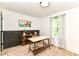 Inviting home office with stylish furnishings, wainscoting and a large window offering natural light at 1620 W New York St, Indianapolis, IN 46222