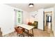 Bright home office with a large window, stylish furnishings and wood-look floors with a geometric rug at 1620 W New York St, Indianapolis, IN 46222