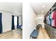 Spacious walk-in closet and bedroom with an organized shelving system and comfortable seating at 1620 W New York St, Indianapolis, IN 46222