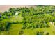 Scenic aerial shot of the property surrounded by lush greenery and open fields at 1633 W 200 North, Greenfield, IN 46140