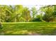 Lush green field and trees provide a quiet and serene outdoor space at 1633 W 200 North, Greenfield, IN 46140