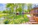 Backyard view with a pond, outbuildings, and ample green space at 1633 W 200 North, Greenfield, IN 46140