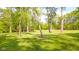 Expansive backyard with mature trees and lush green lawn at 1633 W 200 North, Greenfield, IN 46140