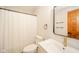 Bathroom with white vanity, gold faucet, neutral walls and shower with white curtain at 1633 W 200 North, Greenfield, IN 46140