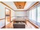 Dining room features a wood ceiling, a view of kitchen and a patterned rug at 1633 W 200 North, Greenfield, IN 46140