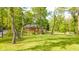 Scenic view of the home overlooking a tranquil pond and lush backyard at 1633 W 200 North, Greenfield, IN 46140