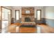 A spacious living room view featuring a brick fireplace with mantel, seamlessly integrating into the home's design at 1633 W 200 North, Greenfield, IN 46140
