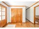 Bright foyer featuring hardwood floors, a large closet, and direct views into other areas of the home at 1633 W 200 North, Greenfield, IN 46140