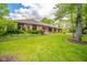 A charming brick home with well-manicured landscaping and lush green lawn is picturesque at 1633 W 200 North, Greenfield, IN 46140
