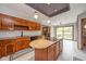 Spacious kitchen with wooden cabinets, granite countertops, large island and access to deck at 1633 W 200 North, Greenfield, IN 46140