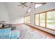 Bright living room with vaulted ceiling, hardwood floors, and large windows with backyard view at 1633 W 200 North, Greenfield, IN 46140