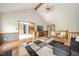 Open-concept living room with view of kitchen, hardwood floors and comfortable seating at 1633 W 200 North, Greenfield, IN 46140