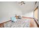 Bright living room with vaulted ceiling, hardwood floors and stylish rug at 1633 W 200 North, Greenfield, IN 46140