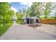 Outbuilding with a covered porch, seating area, and ample parking space at 1633 W 200 North, Greenfield, IN 46140