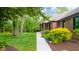 Spacious side yard featuring well-maintained lawn and mature trees at 1633 W 200 North, Greenfield, IN 46140