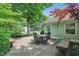 Backyard deck with mature trees and shrubs offers a tranquil outdoor seating area at 1748 Sweet Gum Dr, Indianapolis, IN 46260