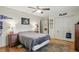 Bedroom featuring hardwood floors, ceiling fan, closet, and bed with comfortable bedding at 1748 Sweet Gum Dr, Indianapolis, IN 46260