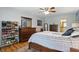 Well appointed bedroom with hardwood floors, ensuite access, and bright neutral walls at 1748 Sweet Gum Dr, Indianapolis, IN 46260