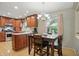 Bright kitchen with stainless steel appliances, granite countertops, and adjacent dining area at 1748 Sweet Gum Dr, Indianapolis, IN 46260