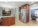 Open concept kitchen includes an island and stainless refrigerator at 1748 Sweet Gum Dr, Indianapolis, IN 46260