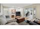 Spacious living room with hardwood floors, comfortable seating, and an open transition to the office at 1748 Sweet Gum Dr, Indianapolis, IN 46260