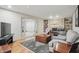 This living room features a stone fireplace, built-in shelving and hardwood floors at 1748 Sweet Gum Dr, Indianapolis, IN 46260