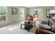 Bright and spacious living room featuring a comfortable seating arrangement and large windows at 1748 Sweet Gum Dr, Indianapolis, IN 46260